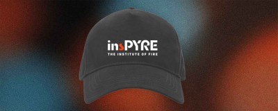 A cap with the insPYRE logo